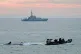 A small boat is towed by a Border Force vessel as Border For