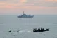 A small boat is towed by a Border Force vessel as Border For