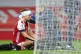 Arsenal's David Luiz receives treatment after a clash of hea