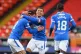 Rangers' James Tavernier (centre) celebrates scoring his sid