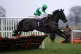 Dame du Soir and jockey Brendan Powell clear a fence before 