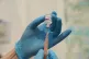 A member of staff prepares a dose of the Oxford/Astrazeneca 