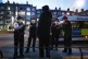Female police officers and special constables talk to a susp