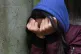 A girl with her head in her hands