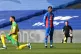 Crystal Palace's Wilfried Zaha stands while players take a k