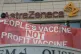 Protesters gather outside AstraZeneca's HQ in Cambridge to d