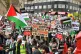 Demonstrators walk through Kensington as they make their way