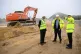 Prime Minister Boris Johnson (centre) talks with Chief Execu