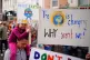 Parents and children take part in a global youth climate str