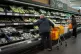 Shoppers in the fruit and vegetables section of a branch of 