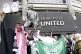 Newcastle United fans outside the stadium hold up a Saudi Ar