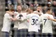 Unity: Tottenham’s Matt Doherty is mobbed by his teammates