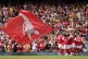 Arsenal's Cedric Soares is mobbed by team-mates after scorin