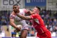 England's Callum Watkins is tackled by Combined Nations Alls