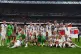 England players celebrate with the trophy following victory 