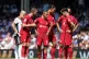 Team-mates check on Liverpool's Thiago Alcantara before he g