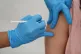 File photo dated 31/07/21 of a person receiving a Covid-19 j
