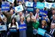Liz Truss (front centre) stands with her supporters as she a