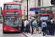 People waiting for a number 16 bus outside Victoria Station,