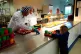 First minister Mark Drakeford serves lunch to reception clas