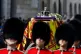 A coffin carrying Elizabeth Windsor's body is paraded throug
