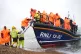 DESPERATE TO WORK: A group of people thought to be migrants 