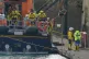 Emergency staff remove a stretcher and body bag from the Dov