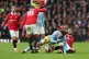 Manchester City's Jack Grealish is tacked by Manchester Unit