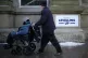 Shoppers walk past a ‘Powered By Levelling Up’ sign rece