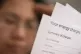 A person holding an energy bill