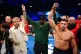 Jake Paul and Tommy Fury pose after a face-off in the ring, 
