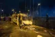 A burnt out police van after a demonstration outside the Sui