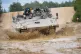 An armoured personnel carrier, on the training range at Bovi