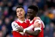 Arsenal's Bukayo Saka (right) celebrates scoring a goal with