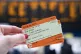 A general view of a person holding train tickets at Waterloo