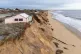 Houses close to the cliff edge at Hemsby in Norfolk, where a