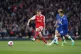 Arsenal’s Martin Odegaard (left) shoots towards goal 