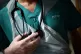 A junior doctor holding his stethoscope at The Royal Blackbu