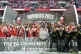 Arsenal players and staff celebrates with the trophy after t