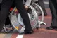 A person in a wheelchair, as a human rights watchdog has cri