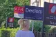 Estate agent signs outside apartments in Lewisham, south-eas