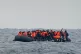 A group of people crossing the Channel in a small boat trave