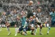 Newcastle United's Kieran Trippier (top) heads the ball clea