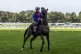 Korker ridden by jockey Clifford Lee ahead on the Blue Eagle