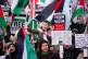 People at a rally in Trafalgar Square, London, during Stop t