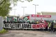 Trade unionists and protesters form a blockade outside weapo