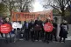Stop Climate Chaos members, dressed as Big Oil CEOs, in blac