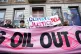 People taking part in a Cop28 London march protest outside B