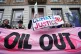 People taking part in a Cop28 London march protest outside B