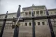 Lock padlocks on a set of gates at the steps of Parliament B